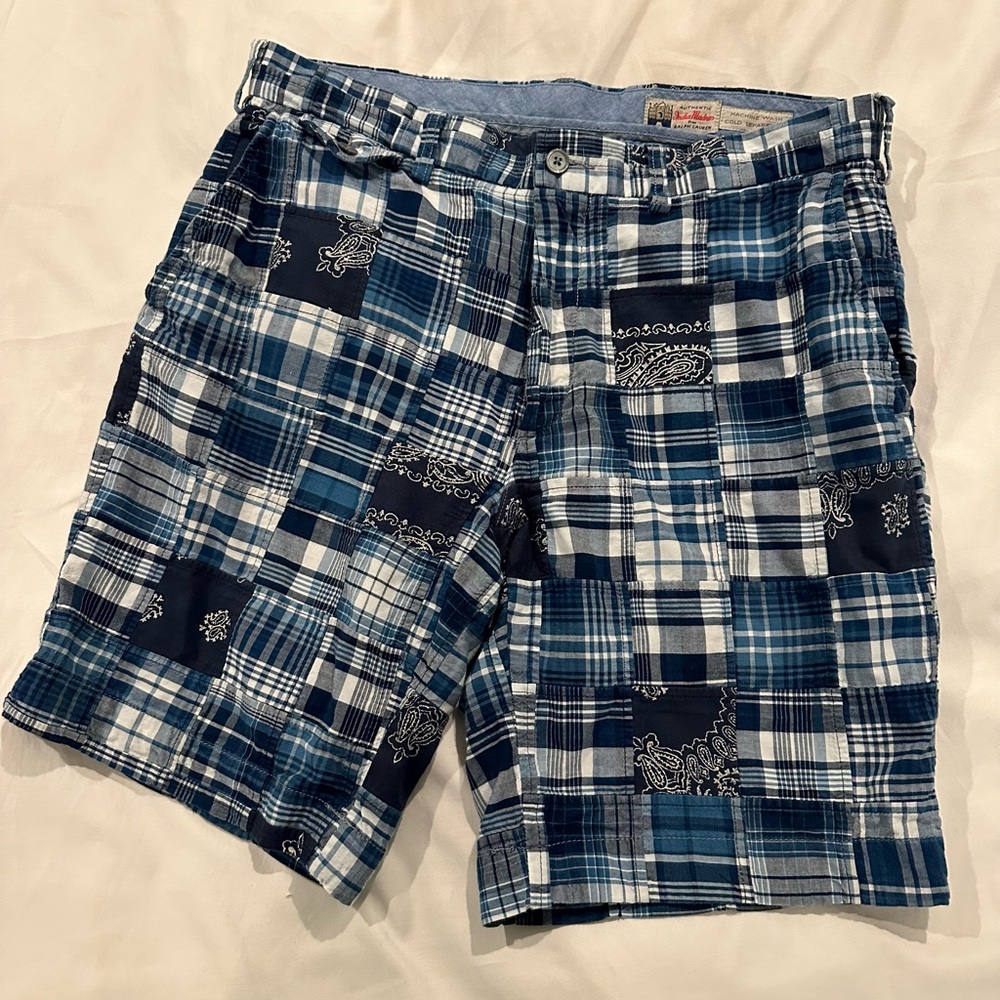 Polo by Ralph Lauren madras shorts with details throughout. Size 32